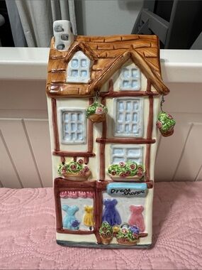 GANZ Ceramic Cottage Wall Hanging in Cream, Brown, Pink, Blue, Green